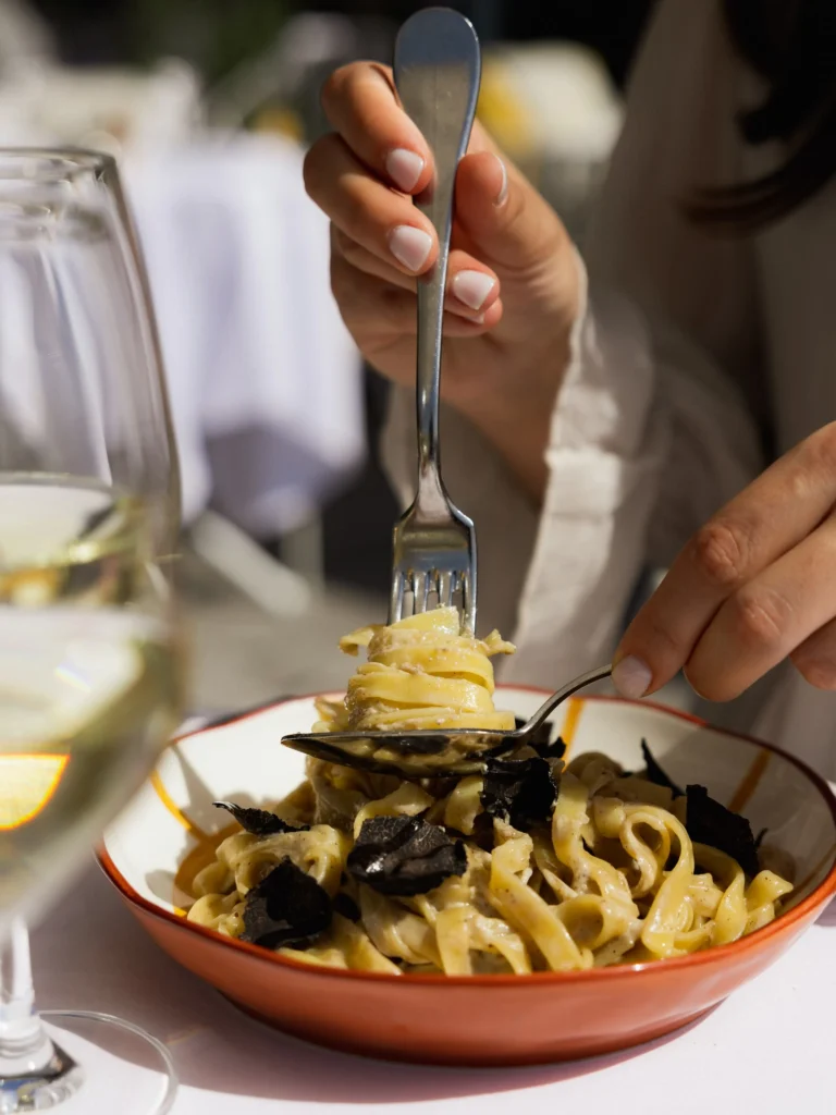 Pasta dish being served at Perruche Paris