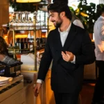 Restaurant staff member inside Perruche Paris