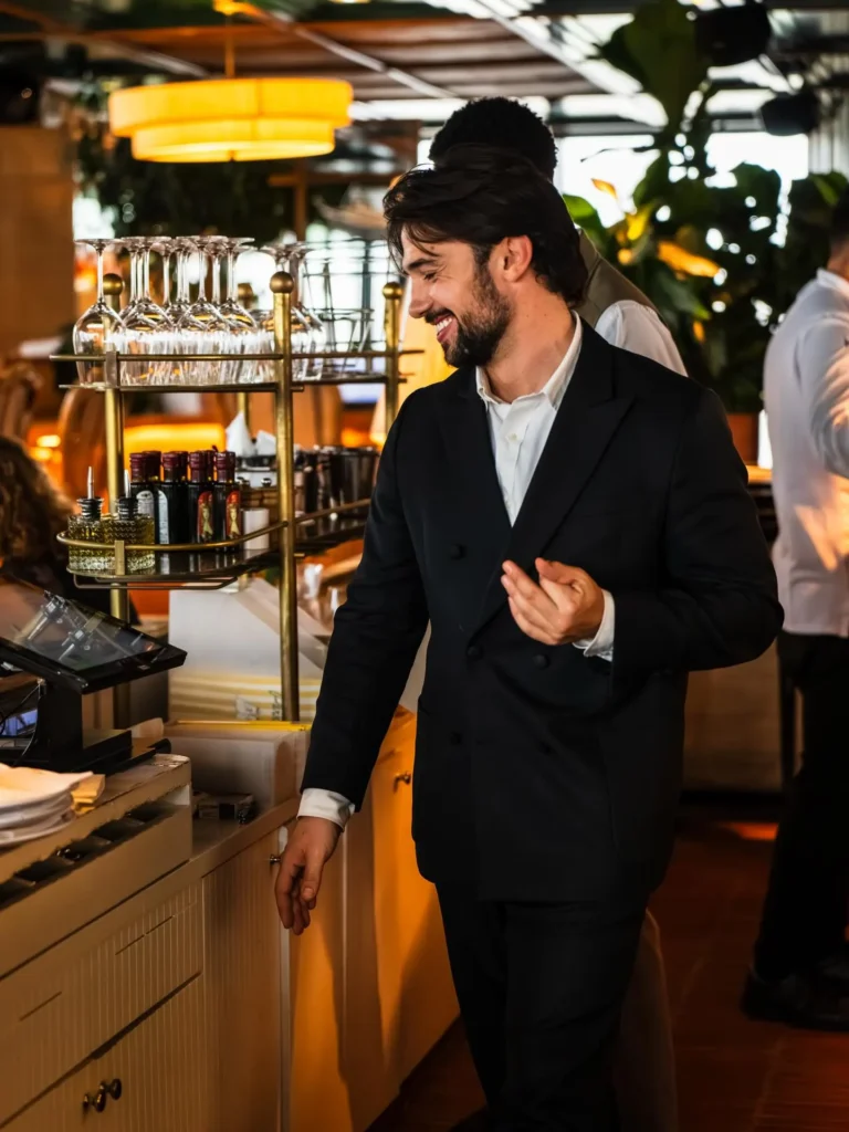 Restaurant staff member inside Perruche Paris