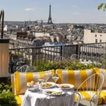Outdoor rooftop dining area at Perruche Paris