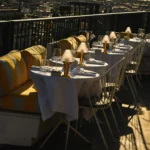 Perruche Paris rooftop terrace overlooking Paris at sunset