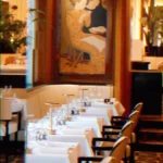 Elegant dining room inside Plaza Athenee in Paris