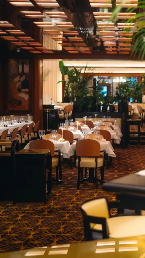 Elegant restaurant dining area at Plaza Athenee in Paris