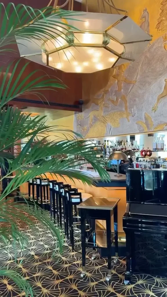 Decorative restaurant interior with greenery at Plaza Athenee in Paris
