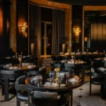 Elegant dining room with dark interiors at the Prince de Galles Paris