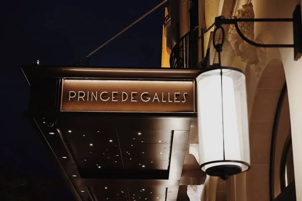 Prince de Galles Paris entrance sign illuminated at night