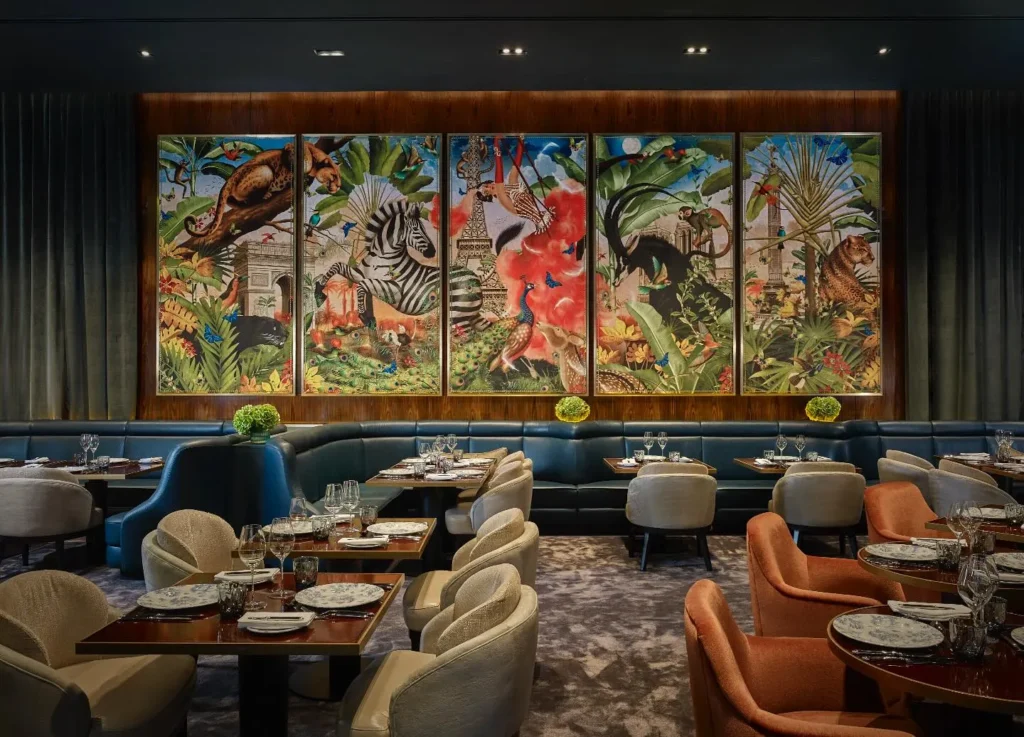Stylish restaurant interior with colorful artwork at the Prince de Galles Paris