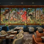 Stylish restaurant interior with colorful artwork at the Prince de Galles Paris