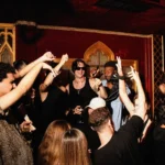 Crowd dancing around the DJ booth at Raspoutine Dubai