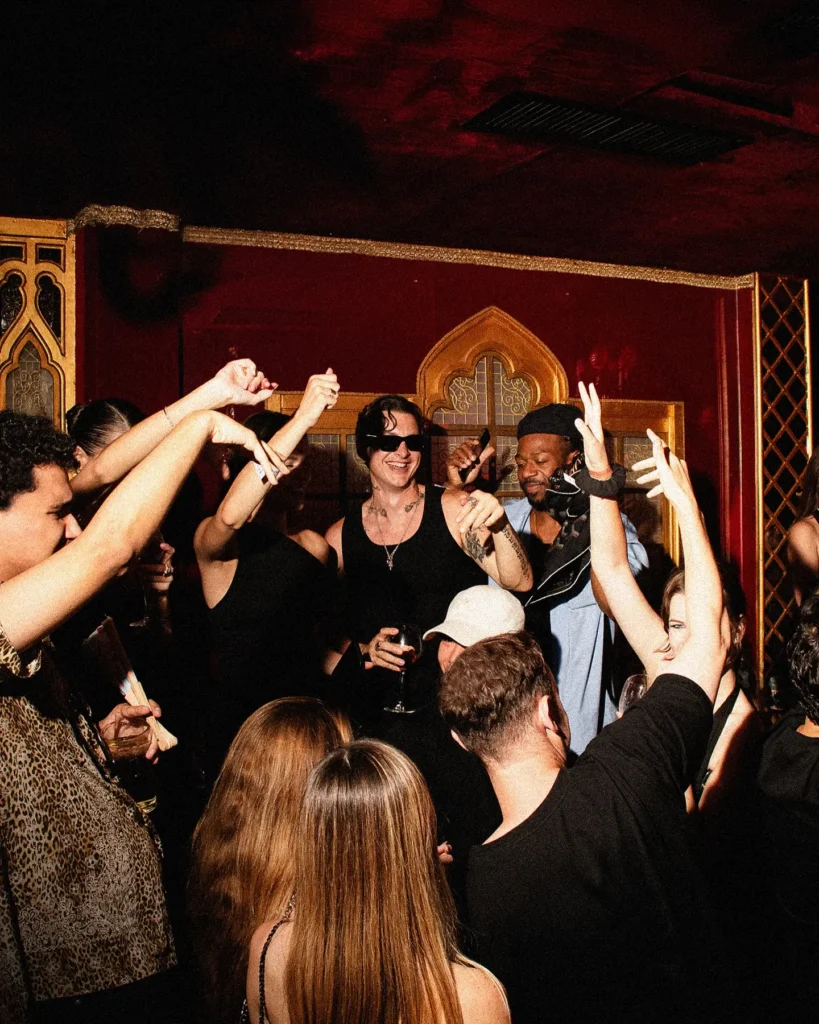 Crowd dancing around the DJ booth at Raspoutine Dubai