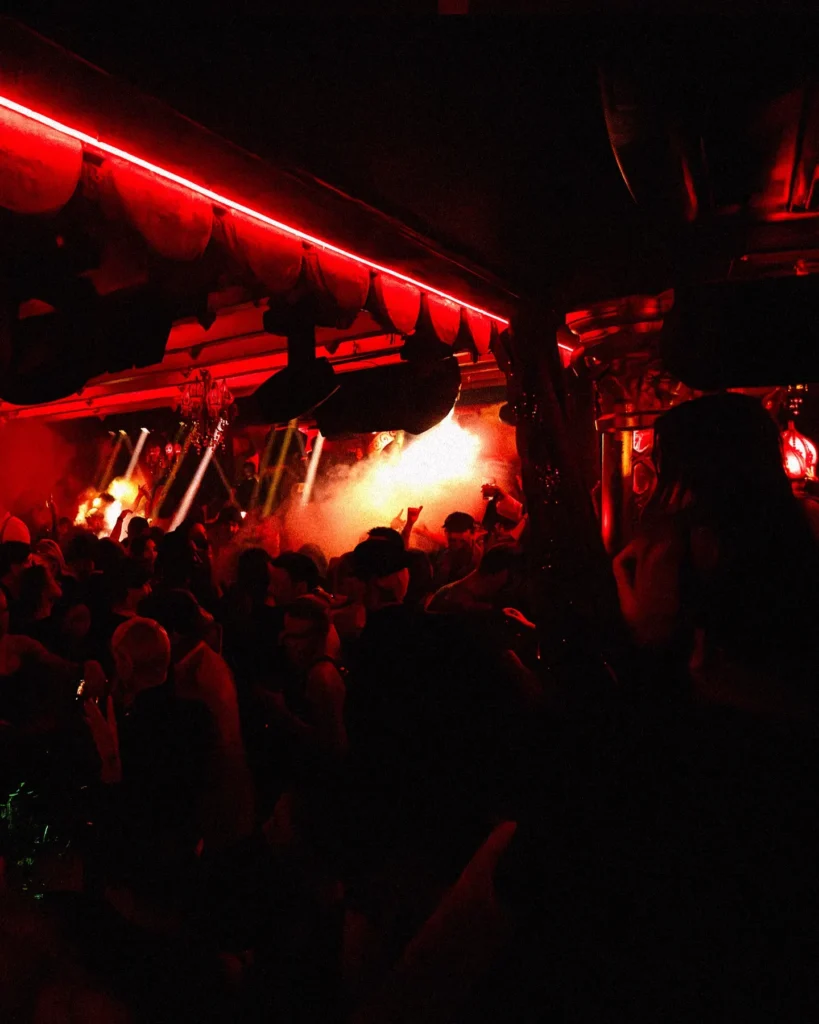 Red-lit nightclub interior at Raspoutine Dubai
