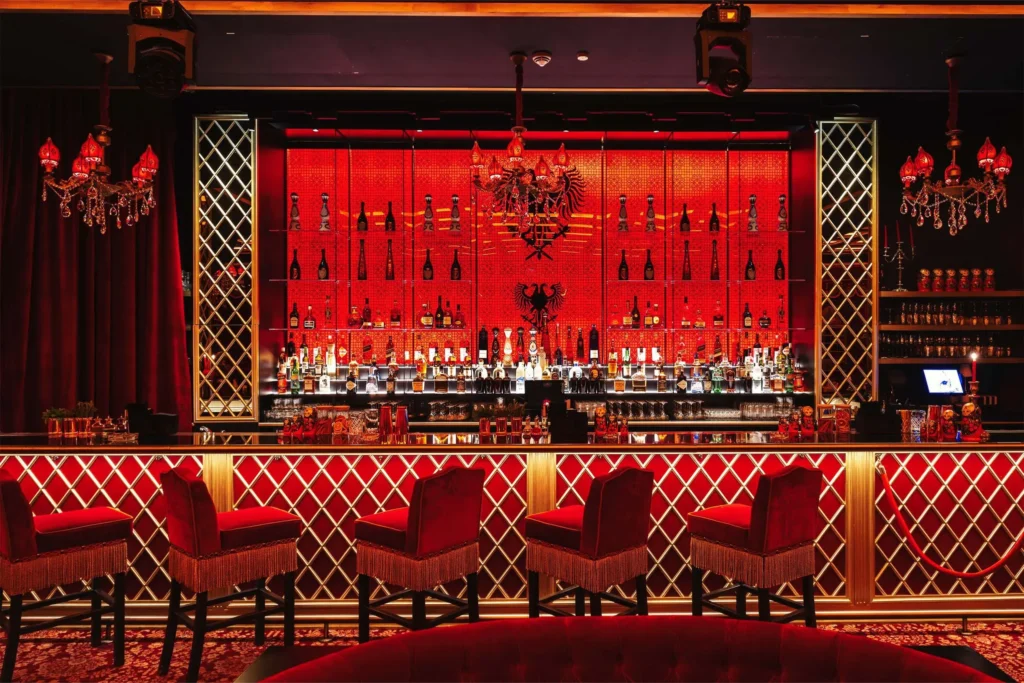 Red-lit bar interior at Raspoutine Paris