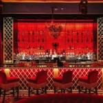 Red-lit bar interior at Raspoutine Paris