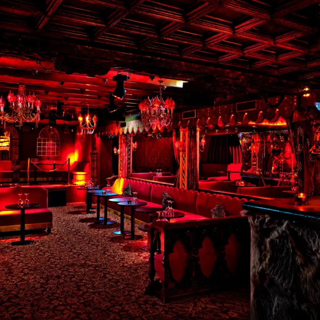 Red-lit nightclub interior at Raspoutine Paris