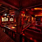 Elegant red-lit interior of Raspoutine Paris nightclub