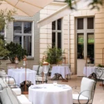 Elegant courtyard terrace with outdoor dining at the Ritz Paris