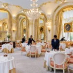 Elegant dining room with chandeliers at the Ritz Paris