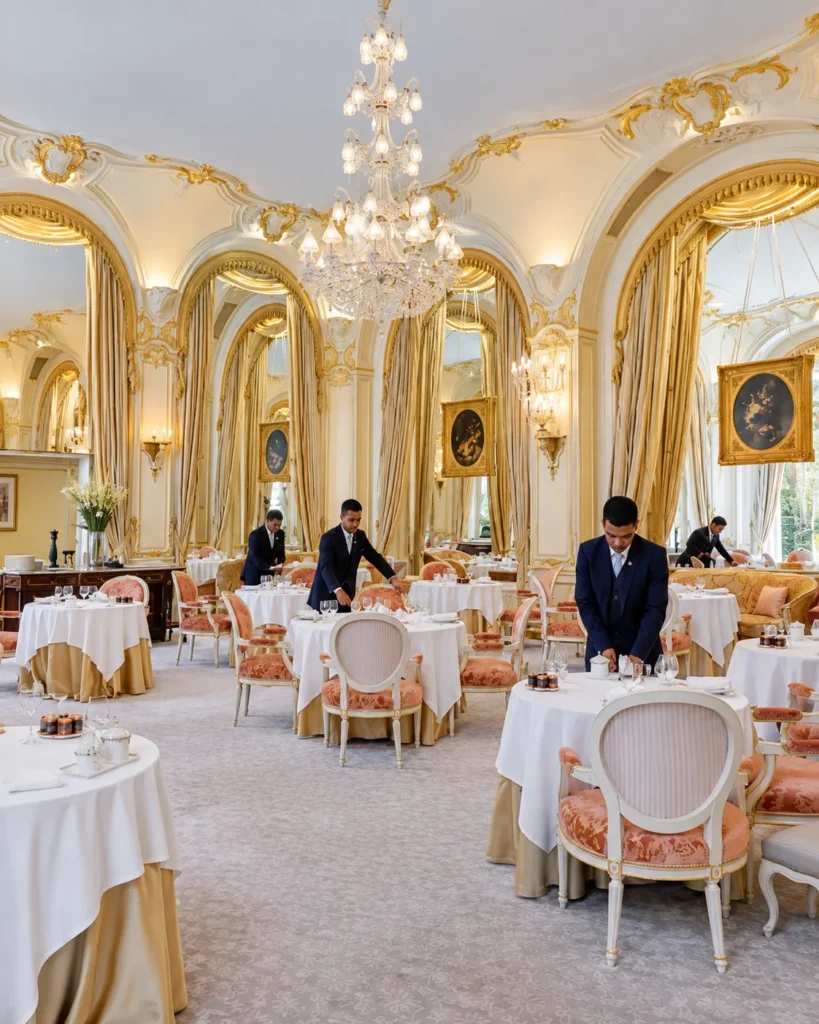 Elegant dining room with chandeliers at the Ritz Paris