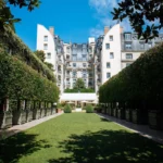 Formal garden and hotel exterior at the Ritz Paris