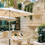 Secluded garden terrace with outdoor seating at the Ritz Paris