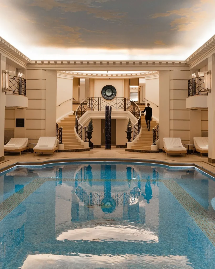 Luxury indoor pool surrounded by classic interiors at the Ritz Paris