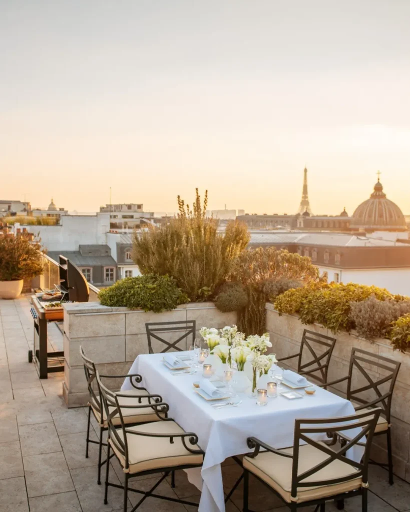 Outdoor dining terrace overlooking the Paris skyline at the Ritz Paris