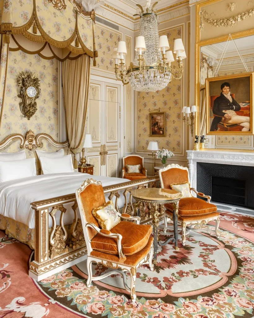 Ornate bedroom and sitting area inside a Ritz Paris suite
