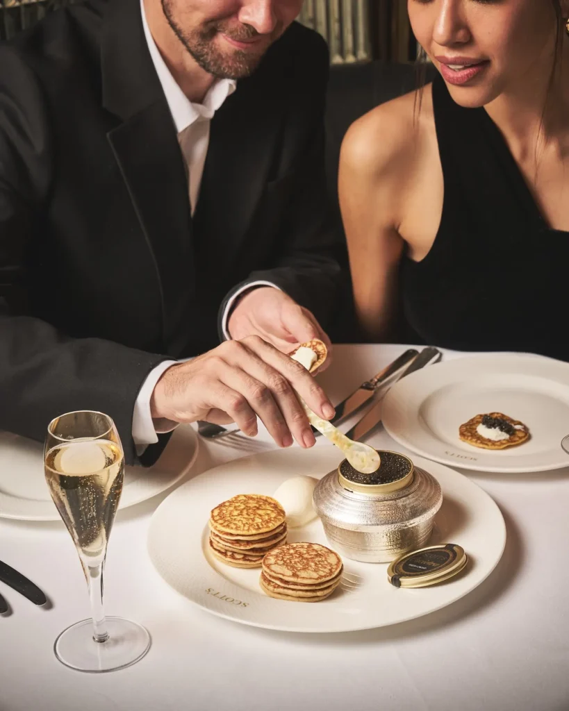 Guests enjoying an elegant fine dining experience at Scott's Mayfair