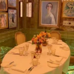 Private dining room with artwork and a round table at Scott's Mayfair