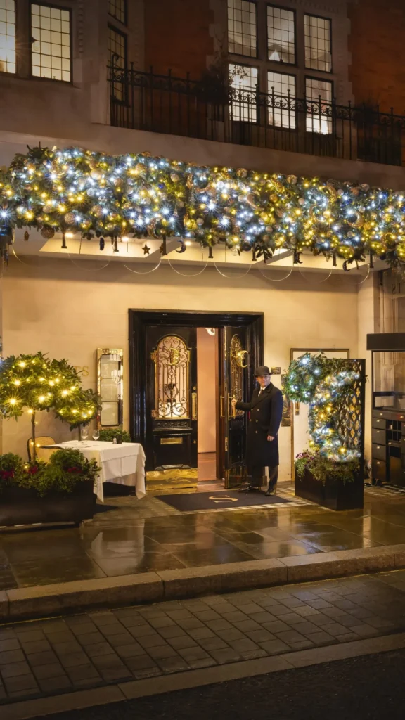 Scott's Mayfair entrance decorated with greenery and outdoor tables