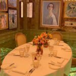Elegant private dining table surrounded by artwork at Scott's Mayfair