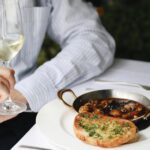 Guest enjoying a seafood dish at Scott's Mayfair restaurant in London