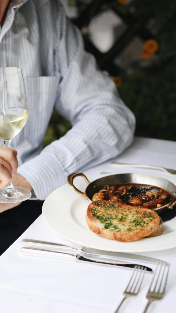 Guest enjoying a seafood dish at Scott's Mayfair restaurant in London