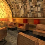 Stone-vaulted lounge seating area at Silencio Club Paris