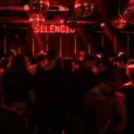 Dark nightclub interior with red lighting at Silencio Club Paris