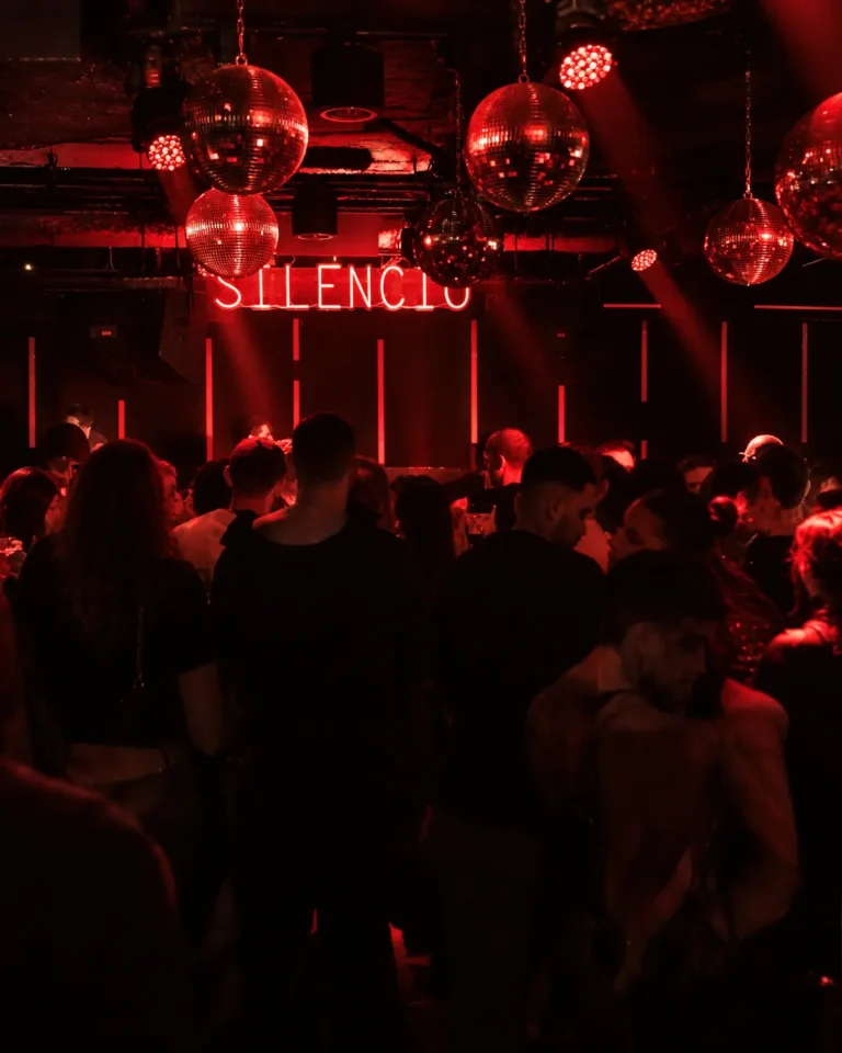 Dark nightclub interior with red lighting at Silencio Club Paris