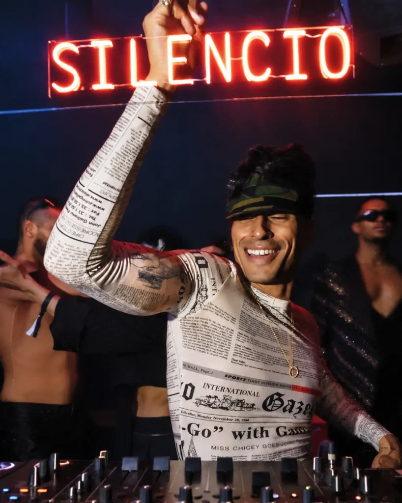 Guest holding a bottle during a night at Silencio Club Paris