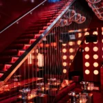 Dramatic staircase and illuminated interior at Silencio Club Paris