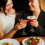 Guests enjoying cocktails and food at STK Milan