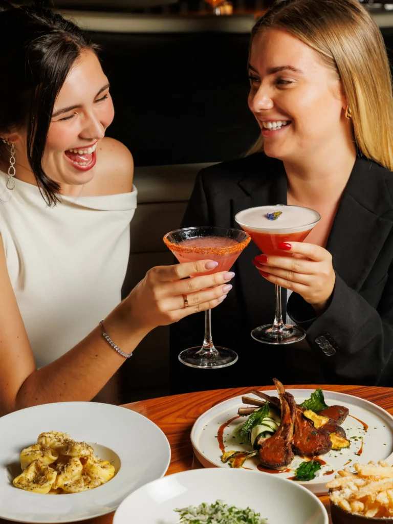 Guests enjoying cocktails and food at STK Milan