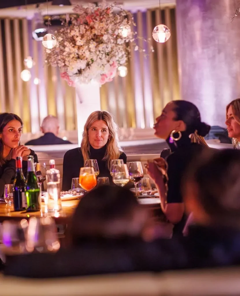 Guests enjoying dinner inside the stylish STK Milan restaurant