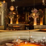 Elegant dining area with warm lighting at STK Milan