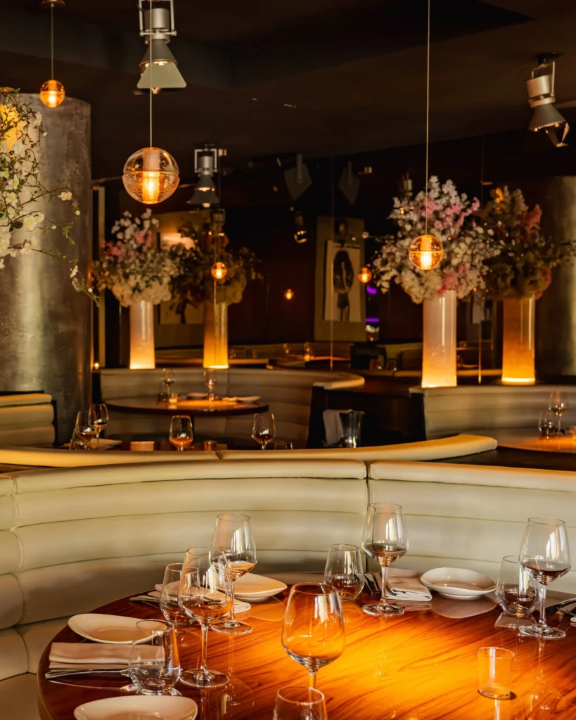 Elegant dining area with warm lighting at STK Milan