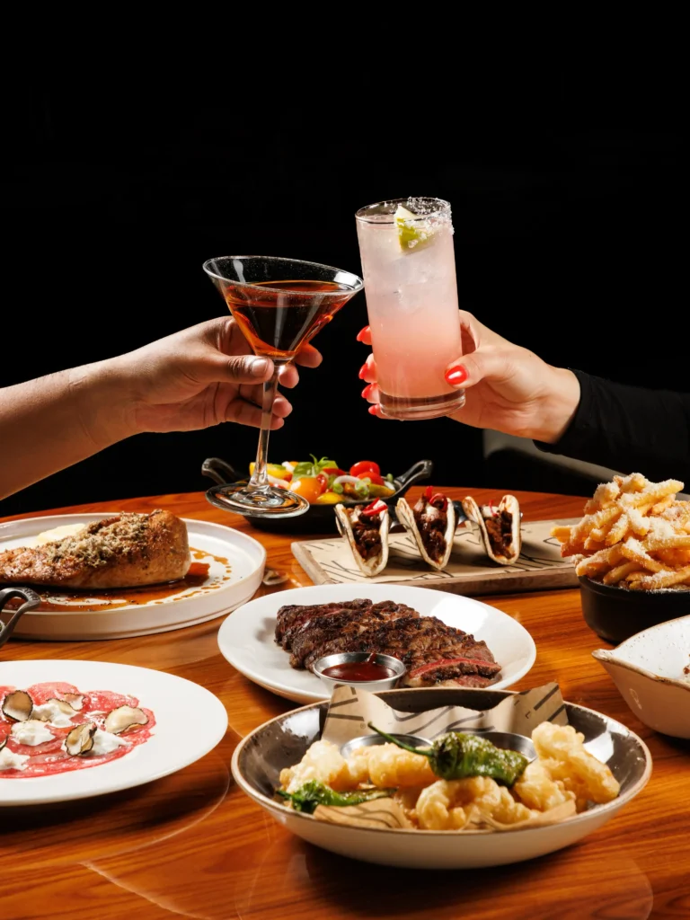 Selection of dishes and cocktails served at STK Milan