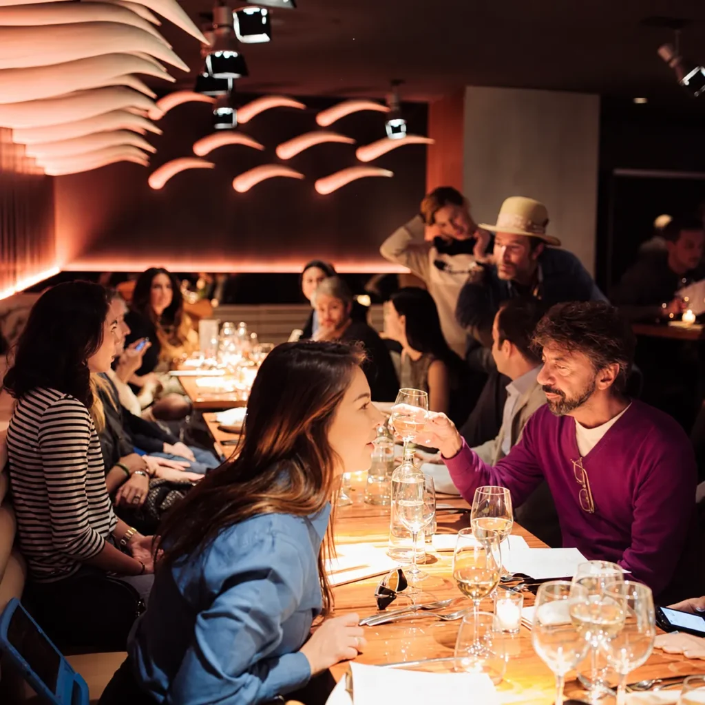 Guests enjoying dinner together at STK Milan