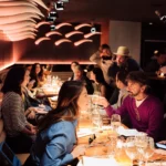 Guests enjoying dinner together at STK Milan