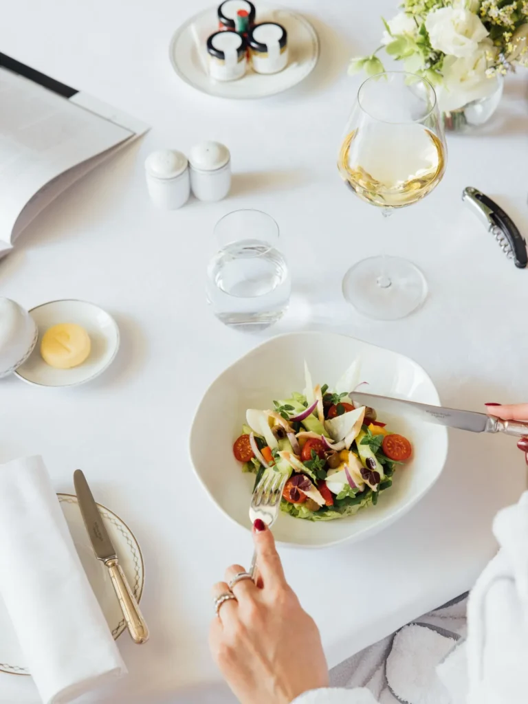 Elegant breakfast table with dishes and drinks at The Peninsula Paris