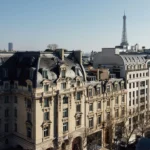 The Peninsula Paris building with the Eiffel Tower visible in the distance