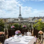 Rooftop dining table with flowers and Eiffel Tower views at The Peninsula Paris