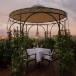 Private rooftop dining dome surrounded by greenery at The Peninsula Paris